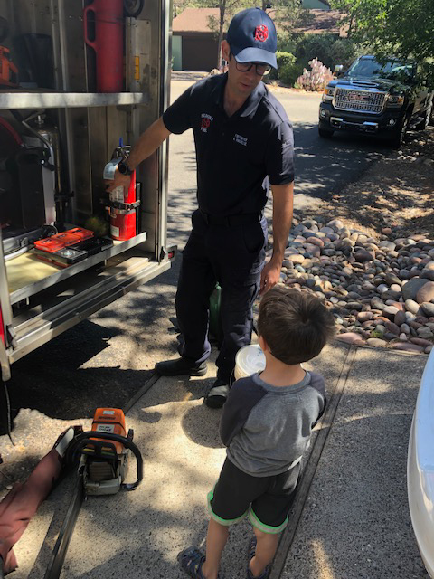 Engineer showing a child the fire engine.