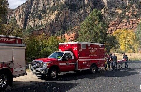 SFD crew loading a patient into an ambulance at Slide Rock.